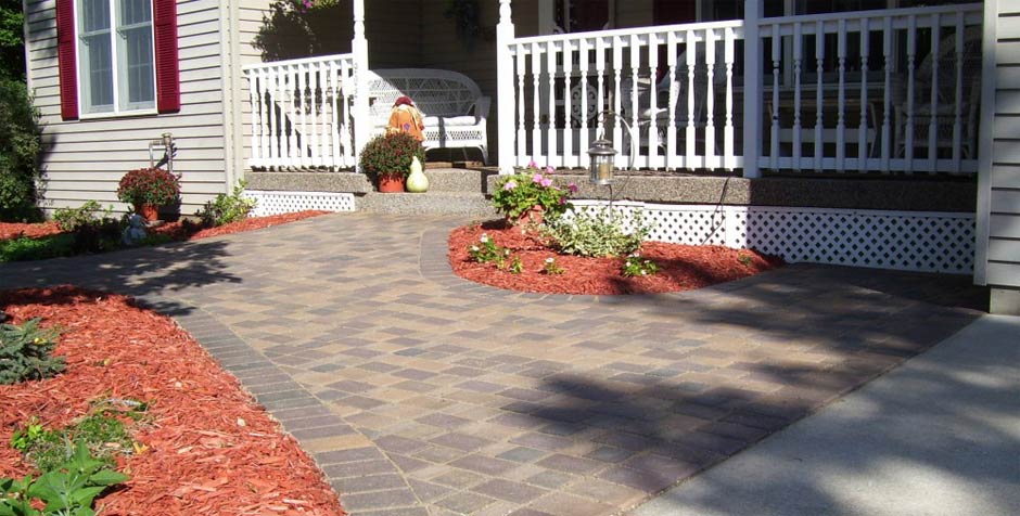 We deliver and spread rock, mulch and edging for your home or business in the South Metro.